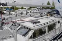Sailboat docked at marina, CR 400 DS model, 2002, with visible rigging and deck details.
