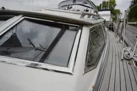 2002 CR 400 DS boat docked, showcasing sleek windows and deck details.