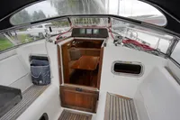 Cockpit view of 2002 CR 400 DS sailboat with wooden interior and seating area.