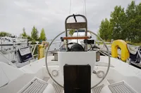 Steering wheel of a 2002 CR 400 DS sailboat docked at a marina.