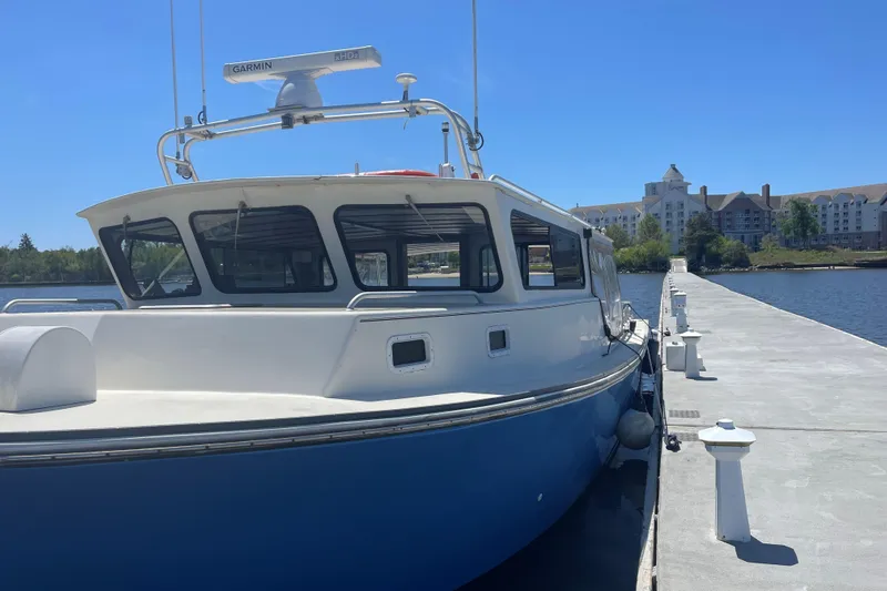 Terrapin Station Yacht Photos Pics 2001 Carman 46 boat docked at marina with clear blue sky.