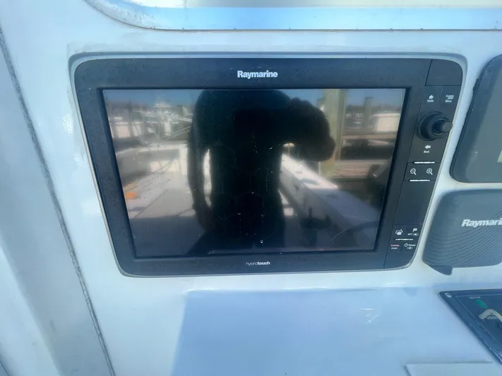  Yacht Photos Pics Raymarine navigation system on 2003 H&H Marine 42 Downeast boat dashboard.