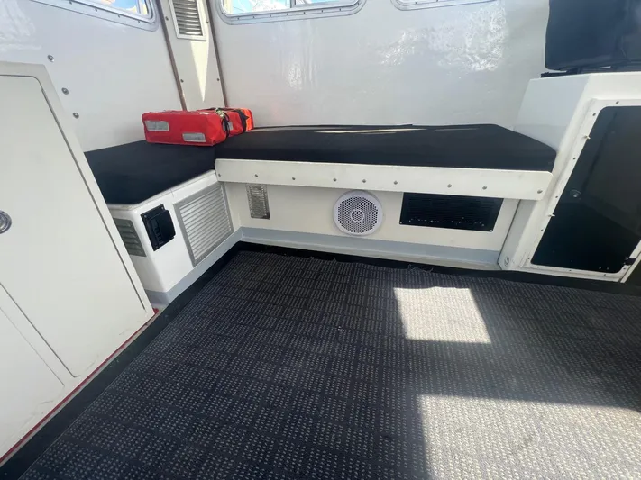  Yacht Photos Pics Interior of 2003 H&H Marine 42 Downeast boat with seating and storage.