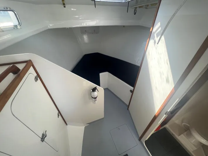  Yacht Photos Pics 2003 H&H Marine 42 Downeast boat interior with white walls and wooden accents.