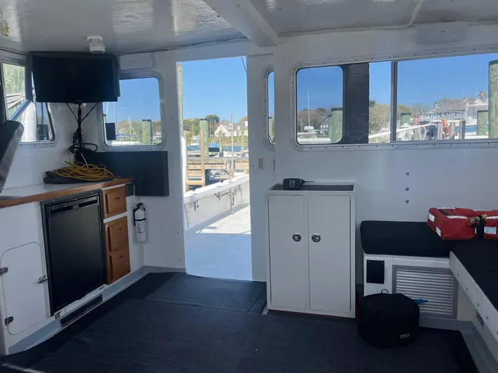  Yacht Photos Pics Interior of 2003 H&H Marine 42 Downeast boat with modern amenities and dock view.