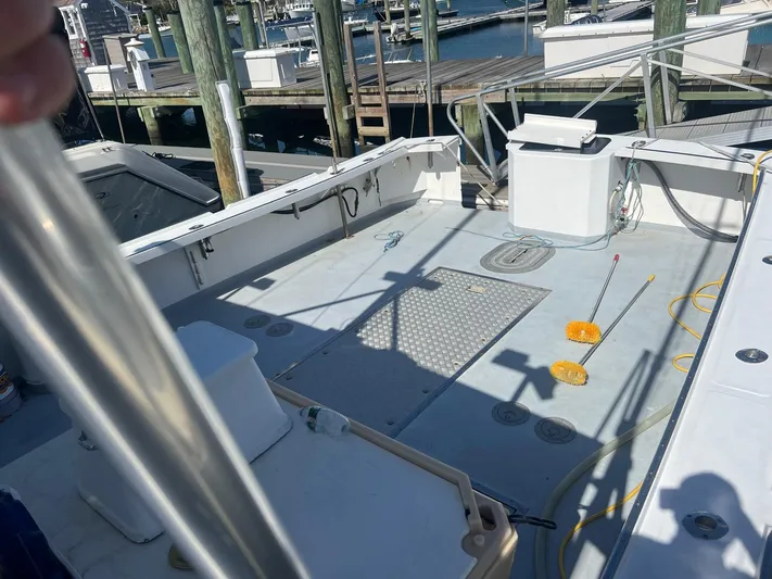  Yacht Photos Pics 2003 H&H Marine 42 Downeast boat deck with equipment and dock view.