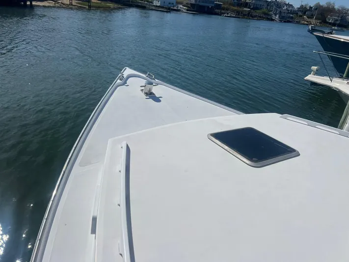 Yacht Photos Pics Bow view of 2003 H&H Marine 42 Downeast boat on calm water.