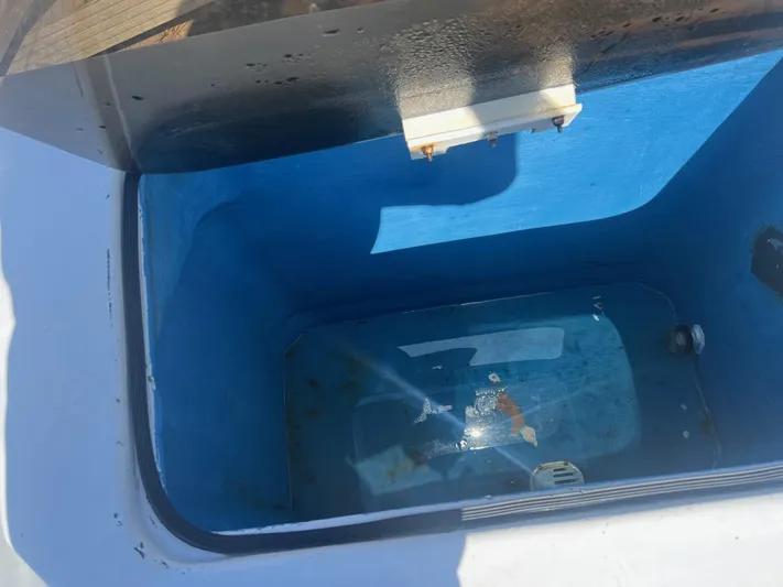  Yacht Photos Pics Livewell on 2003 H&H Marine 42 Downeast boat, blue interior, open lid.