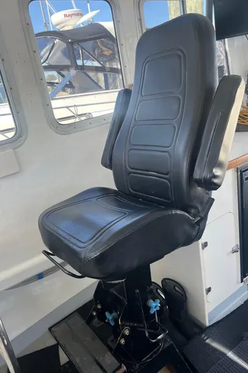  Yacht Photos Pics Black captain's chair in 2003 H&H Marine 42 Downeast boat interior.