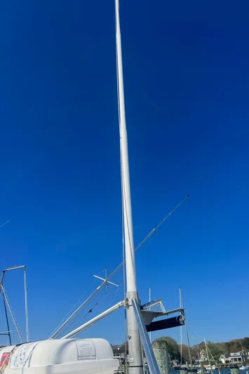  Yacht Photos Pics H&H Marine 42 Downeast 2003 boat mast against clear blue sky.