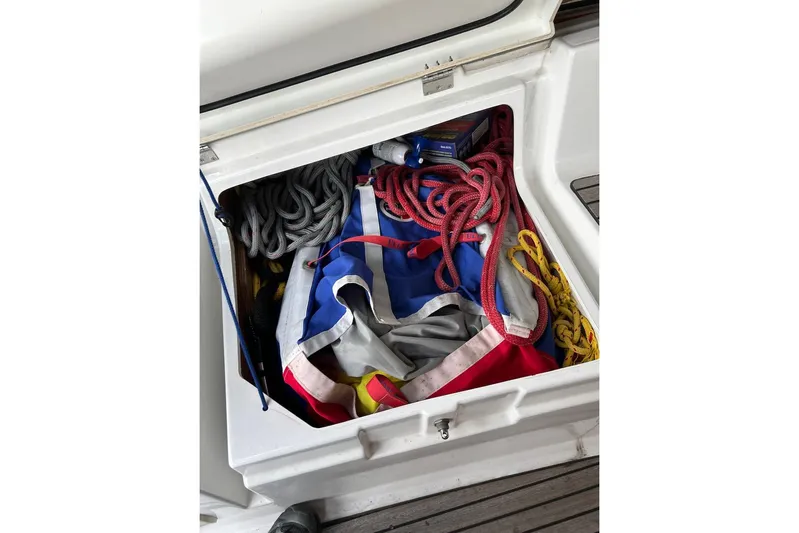 Cruzeiro Do Sul Yacht Photos Pics Storage compartment on 2013 Jeanneau Sun Odyssey 44 DS with ropes and sailing gear.