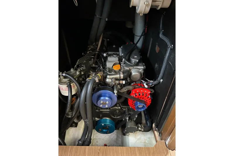 Cruzeiro Do Sul Yacht Photos Pics Engine compartment of 2013 Jeanneau Sun Odyssey 44 DS sailboat, showcasing mechanical components.