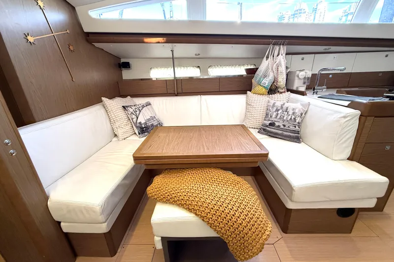 Cruzeiro Do Sul Yacht Photos Pics Interior of 2013 Jeanneau Sun Odyssey 44 DS yacht with cozy seating and decor.