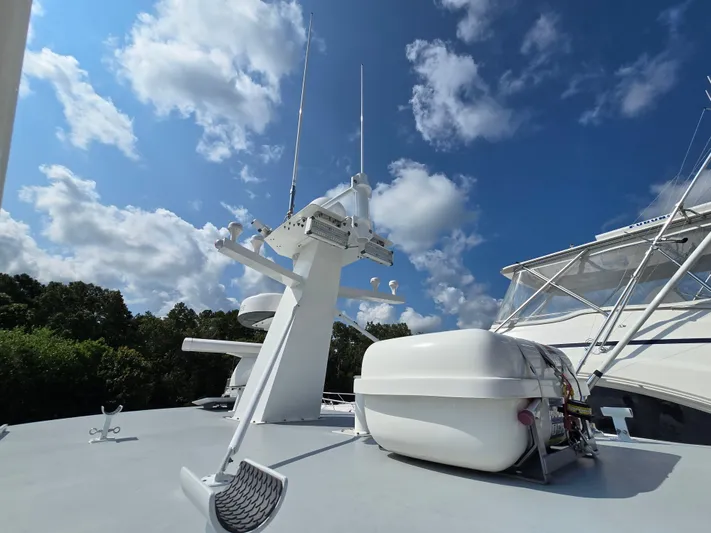 "silver Lining" Yacht Photos Pics Boat deck with radar equipment under a blue sky, Flowers Down East model, 2022.