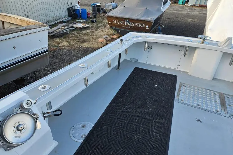 "silver Lining" Yacht Photos Pics 2022 Flowers Down East boat deck with fishing equipment and storage compartments.