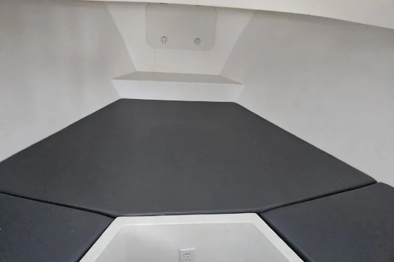 "silver Lining" Yacht Photos Pics Interior of 2022 Flowers Down East boat with cushioned seating and storage.