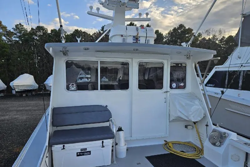 "silver Lining" Yacht Photos Pics Back view of a 2022 Flowers Down East boat with seating and equipment.