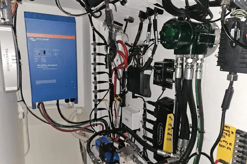 "silver Lining" Yacht Photos Pics Electrical equipment setup with Victron Energy MultiPlus Compact and various cables, 2022.