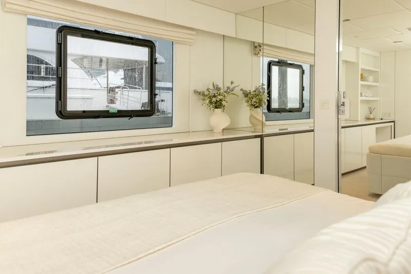 Fat Cat Yacht Photos Pics Luxurious interior of 2024 Sunreef 80 Power yacht with elegant decor and large window.