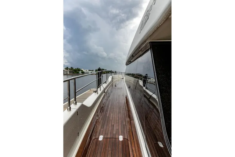 Fat Cat Yacht Photos Pics Luxurious Sunreef 80 Power yacht deck, 2024 model, with sleek design and wooden flooring.