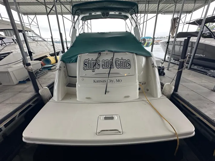  Yacht Photos Pics 2000 Formula 40 PC boat docked, covered with green tarp, named "Ships and Gins," Kansas City, MO.