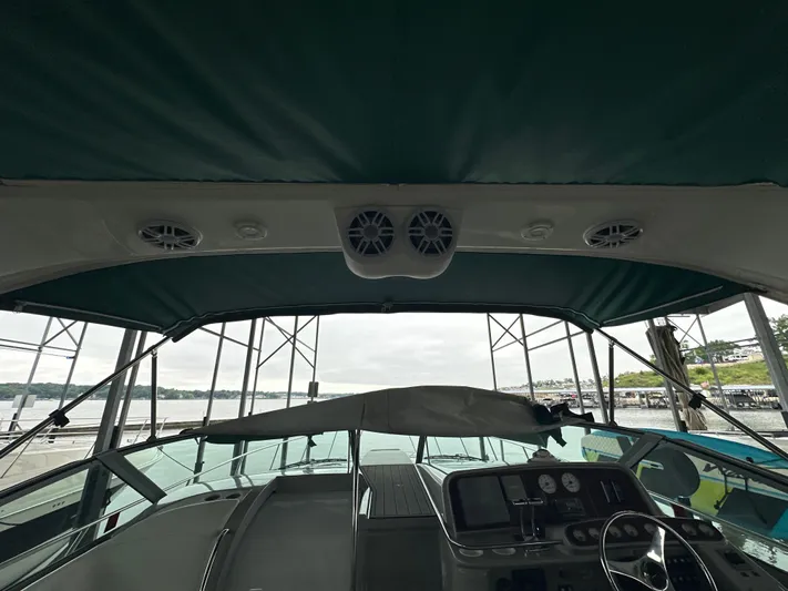  Yacht Photos Pics Interior view of a 2000 Formula 40 PC boat with covered helm and dashboard.