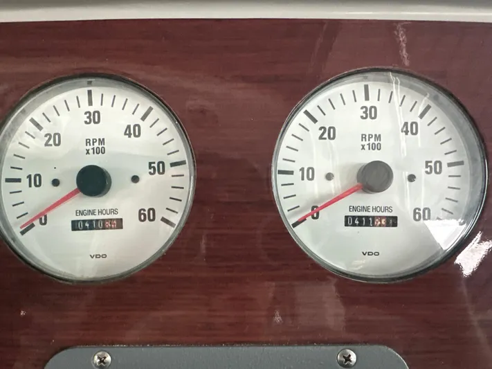  Yacht Photos Pics Dashboard gauges of a 2000 Formula 40 PC boat showing RPM and engine hours.
