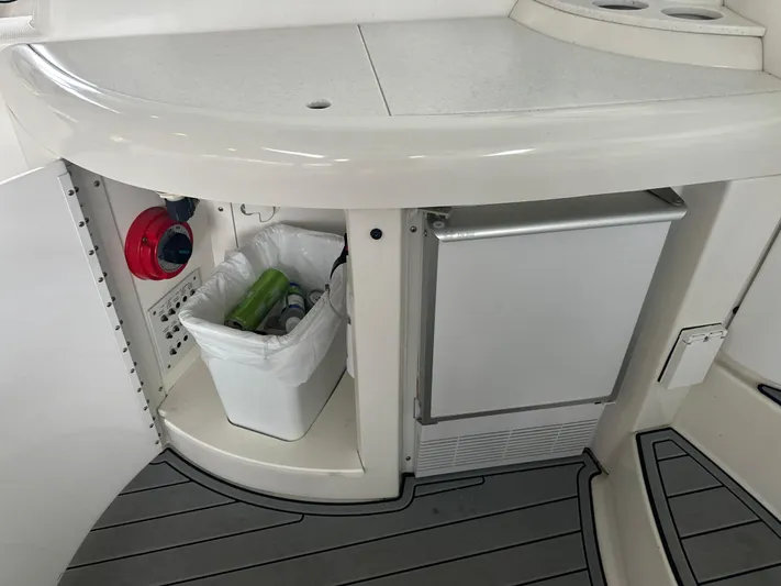  Yacht Photos Pics 2000 Formula 40 PC yacht interior with mini fridge and storage compartment.