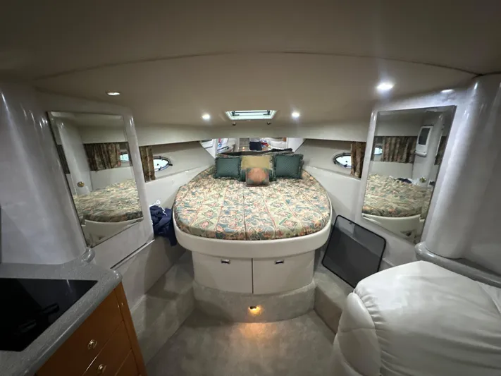  Yacht Photos Pics Interior of a 2000 Formula 40 PC yacht with a cozy bed and modern amenities.
