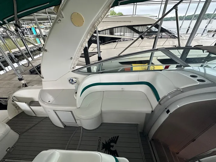  Yacht Photos Pics Interior view of a 2000 Formula 40 PC yacht with white seating and green accents.