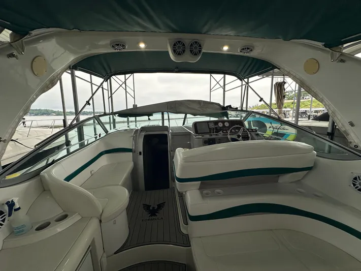  Yacht Photos Pics Interior view of a 2000 Formula 40 PC yacht with white seating and green accents.