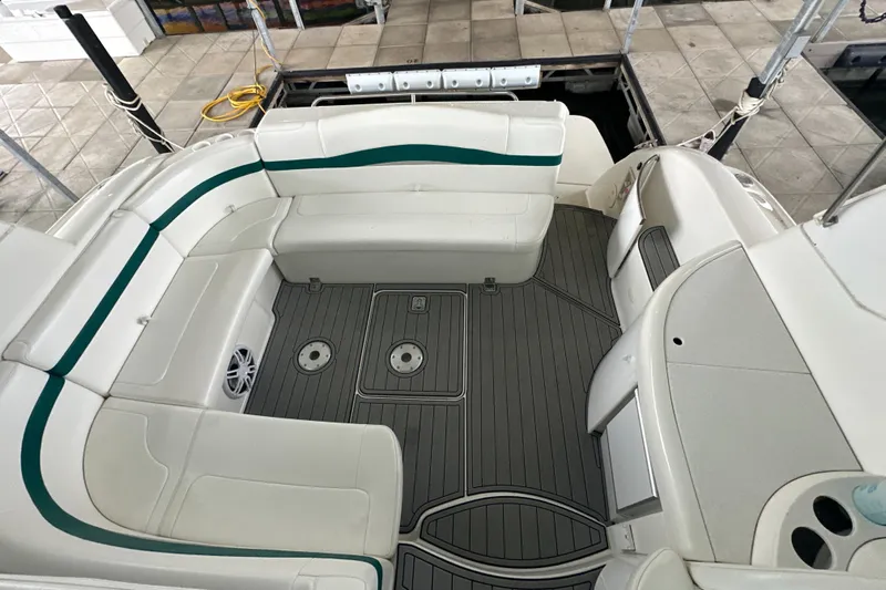  Yacht Photos Pics 2000 Formula 40 PC boat interior with white seating and gray flooring.