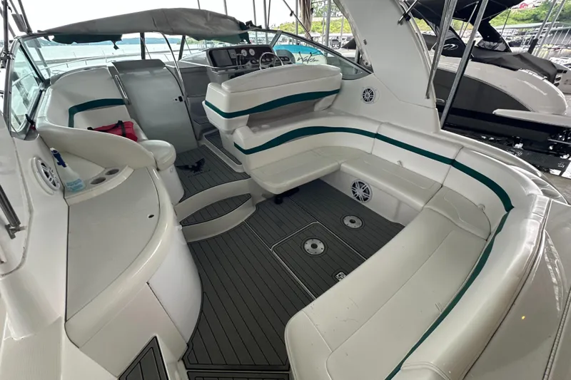  Yacht Photos Pics 2000 Formula 40 PC boat interior with white seating and modern dashboard.
