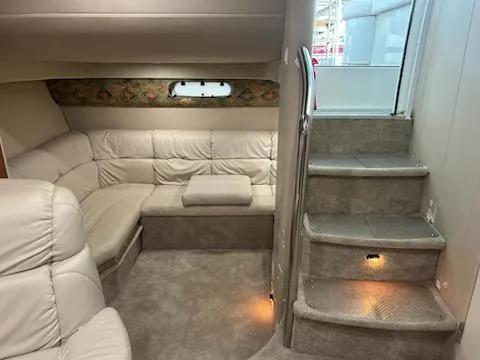  Yacht Photos Pics Interior of 2000 Formula 40 PC yacht with plush seating and carpeted stairs.
