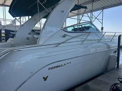  Yacht Photos Pics 2000 Formula 40 PC yacht docked under a covered marina.