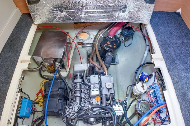 Katara Yacht Photos Pics Engine compartment of a 2005 Leopard 43 yacht, showcasing mechanical components and wiring.
