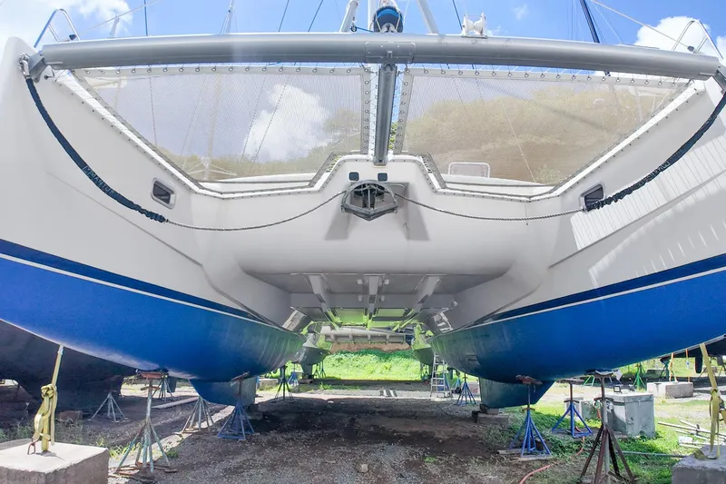 Katara Yacht Photos Pics 2005 Leopard 43 catamaran on stands, showcasing blue hull and underbody details.