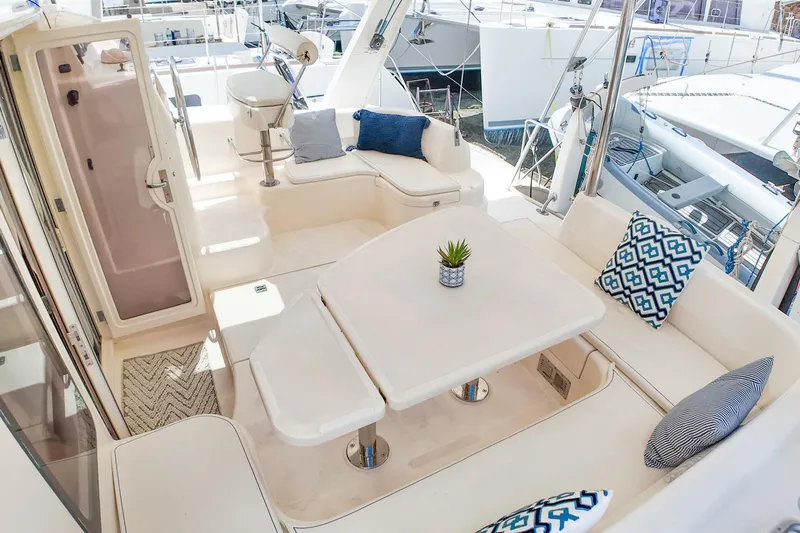 Katara Yacht Photos Pics Luxurious 2005 Leopard 43 yacht interior with plush seating and elegant decor.