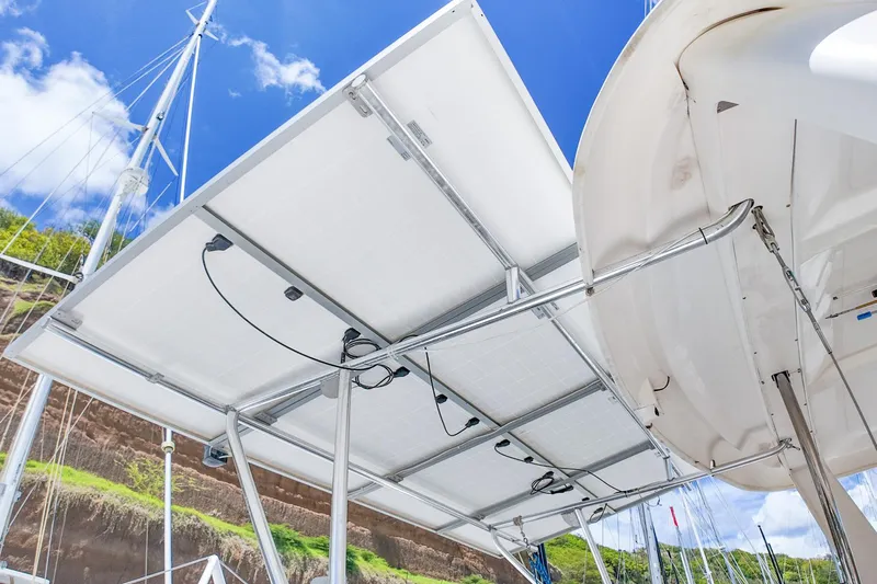 Katara Yacht Photos Pics Solar panels on a 2005 Leopard 43 catamaran, under a clear blue sky.