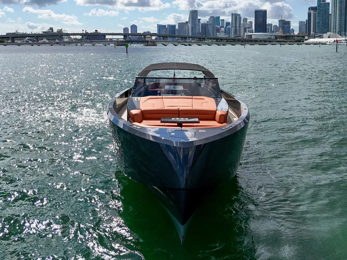  Yacht Photos Pics Luxury Vanquish VQ58 yacht cruising near city skyline, 2020 model.