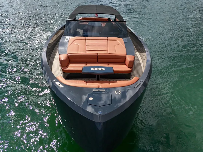  Yacht Photos Pics Luxury 2020 Vanquish VQ58 yacht with sleek design and spacious seating on water.