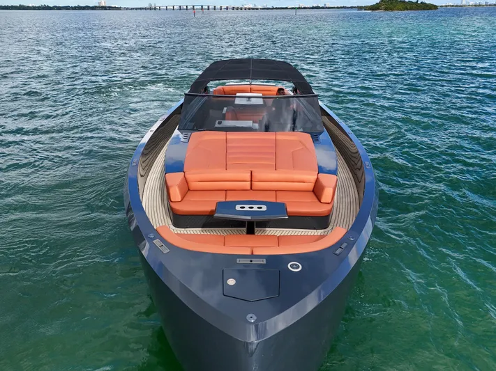  Yacht Photos Pics Luxury 2020 Vanquish VQ58 yacht with sleek design and orange seating on open water.