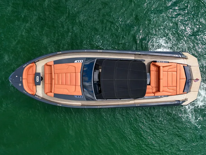  Yacht Photos Pics Aerial view of 2020 Vanquish VQ58 luxury yacht on green water.