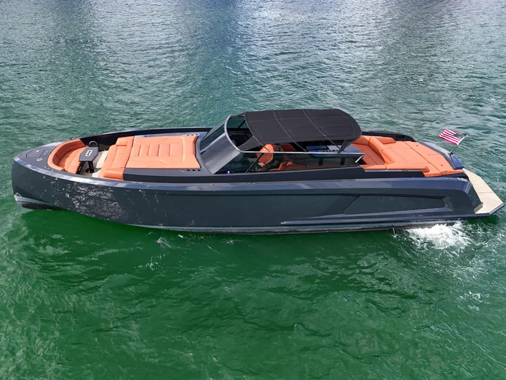  Yacht Photos Pics Luxury 2020 Vanquish VQ58 yacht cruising on clear water.