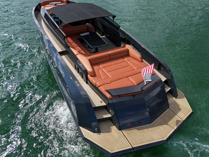  Yacht Photos Pics Luxury 2020 Vanquish VQ58 yacht cruising on water, featuring sleek design and spacious deck.
