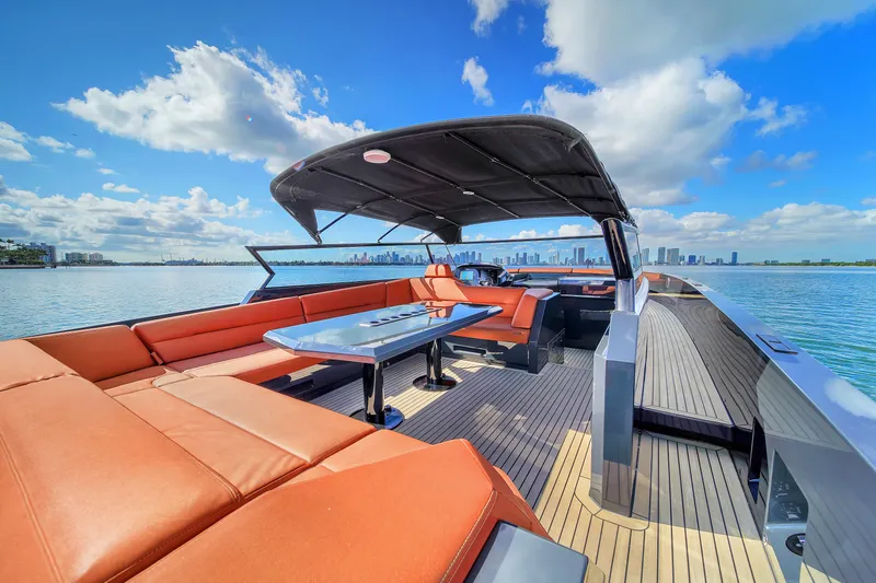  Yacht Photos Pics Luxurious 2020 Vanquish VQ58 yacht with spacious deck and city skyline view.