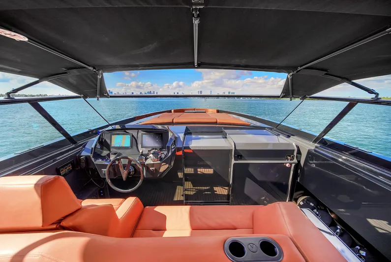  Yacht Photos Pics Luxurious 2020 Vanquish VQ58 yacht interior with leather seating and modern dashboard.