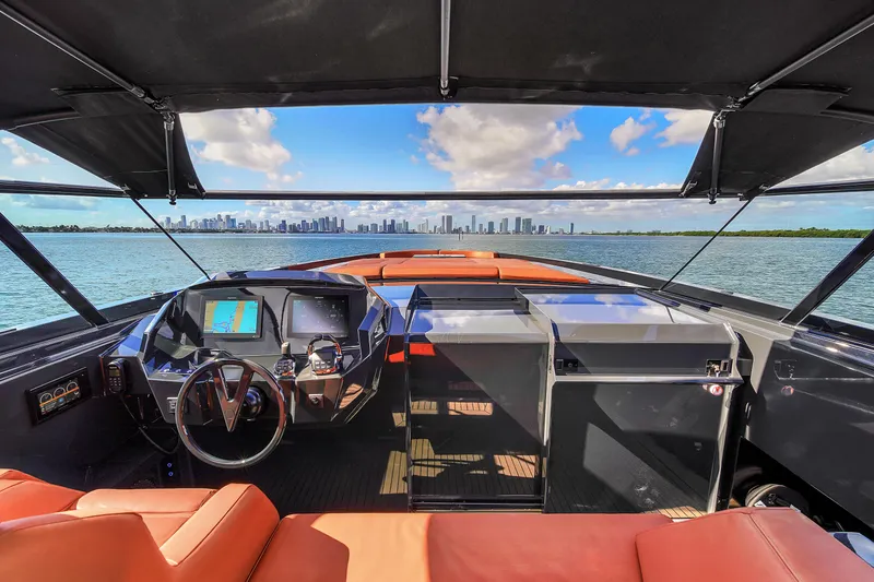  Yacht Photos Pics Luxurious 2020 Vanquish VQ58 yacht cockpit with city skyline view.