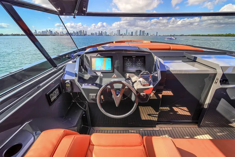  Yacht Photos Pics Luxurious 2020 Vanquish VQ58 yacht cockpit with city skyline view.