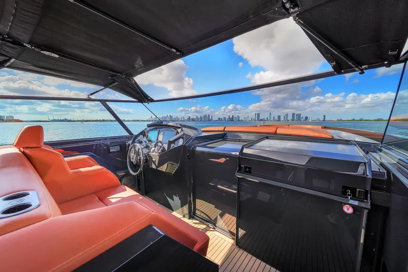  Yacht Photos Pics Luxurious 2020 Vanquish VQ58 yacht interior with city skyline view.